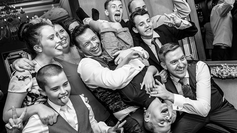 group having fun in front of selfie mirror,gay wedding
