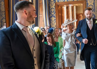 Mother of the bride walks down isle at Soughton Hall