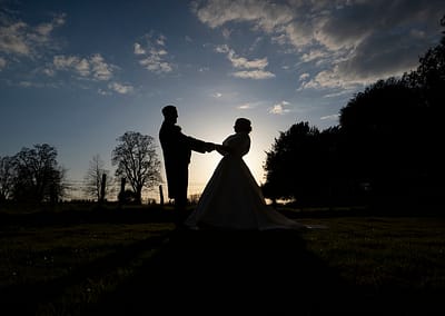 Silhouette of newly married couple at Soughton Hall. Wedding Photography by Studio 900
